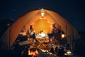 Asian couple enjoy in they tent in camping trip on night time Royalty Free Stock Photo