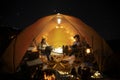 Asian couple enjoy in they tent in camping trip on night time Royalty Free Stock Photo