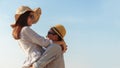 Asian couple expressing their feeling while standing at beach, Young couples hug on blue sky