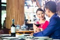 Asian couple fine dining in restaurant Royalty Free Stock Photo