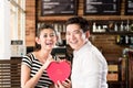 Asian couple having date in coffee shop with red heart Royalty Free Stock Photo