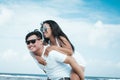 Asian couple having fun on the beach of tropical Bali island, Indonesia. Royalty Free Stock Photo