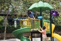 Asian couple having fun at playground