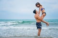 Couple having fun and ramance moment playing together on beach