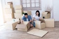 Asian couple, husband and attractive wife are happiness and are helping each other lose things into boxes