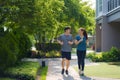 Asian couple are jogging in the neighborhood for daily health and well being, both physical and mental and simple antidote to