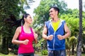 Asian couple jogging or running in park for fitness Royalty Free Stock Photo