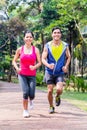 Asian couple jogging or running in park for fitness Royalty Free Stock Photo