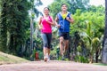 Asian couple jogging or running in park for fitness Royalty Free Stock Photo