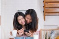 Asian couple lesbian hug each other when have breakfast in morning at home.LGBTQ lifestyle concept