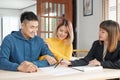 Asian couple listening to realtor agent explaination about house Royalty Free Stock Photo