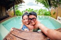 Asian couple love in swimming pool Royalty Free Stock Photo