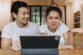 Asian couple lover in cafe get confused with application in the tablet computer Royalty Free Stock Photo