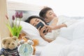 Woman uses smart phone, boyfriend  watches her Royalty Free Stock Photo