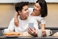 Asian Couple Making Selfie On Smartphone Having Breakfast In Kitchen Royalty Free Stock Photo