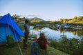 Asian couple Camp on the mountain in the upper village near the lake, Camping Travel Concept,Travel Relax concept Map Royalty Free Stock Photo