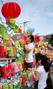 Asian couple puts a donation into Chinese lanterns