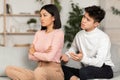 Asian Couple After Quarrel, Husband Talk To Offended Wife Indoor