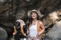 An Asian couple spent their vacation hiking along nature trail, visiting waterfall and enjoying forest views together. Royalty Free Stock Photo