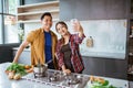 asian couple taking selfie while cooking together in the kitchen Royalty Free Stock Photo