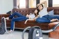 Asian couple tired to cleaning floor with vaccuum cleaner.