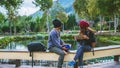 Asian couple travel photograph nature education. nature relax and study read a book. at public park. In Thailand