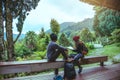 Asian couple travel photograph nature education. nature relax and study read a book. at public park. In Thailand Royalty Free Stock Photo