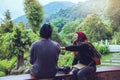 Asian couple travel photograph nature education. nature relax and study read a book. at public park. In Thailand Royalty Free Stock Photo