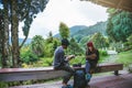 Asian couple travel photograph nature education. nature relax and study read a book. at public park. In Thailand Royalty Free Stock Photo