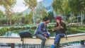 Asian couple travel photograph nature education. nature relax and study read a book. at public park. In Thailand Royalty Free Stock Photo