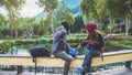 Asian couple travel photograph nature education. nature relax and study read a book. at public park. In Thailand Royalty Free Stock Photo