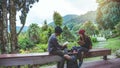 Asian couple travel photograph nature education. nature relax and study read a book. at public park. In Thailand Royalty Free Stock Photo