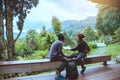 Asian couple travel photograph nature education. nature relax and study read a book. at public park. In Thailand Royalty Free Stock Photo