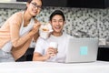 Asian couple working from home with take out food Royalty Free Stock Photo