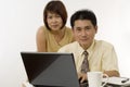 Asian couple working together Royalty Free Stock Photo