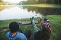 Asian couples feel relaxed and happy with morning drinking coffee by the lake. Couple romantic traveling camping, Honeymoon