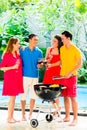 Asian couples having barbecue and drinking wine Royalty Free Stock Photo