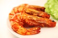 Asian cuisine. Fried prawns on tomato sauce