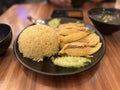 Asian cuisine Hainanese chicken rice with soup, salad and sauce.