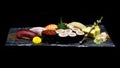 Asian cuisine or Japanese food. Sushi medium set on wooden plate Royalty Free Stock Photo