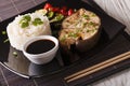 Asian Cuisine: Steak white fish, rice and sauce close-up. horizontal Royalty Free Stock Photo