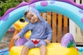 Asian cute baby boy playing in inflatable baby pool Royalty Free Stock Photo