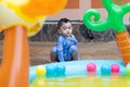 Asian cute baby boy playing in inflatable baby pool Royalty Free Stock Photo