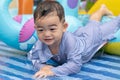 Asian cute baby boy playing in inflatable baby pool Royalty Free Stock Photo