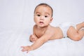 asian cute baby boy on white bed Royalty Free Stock Photo