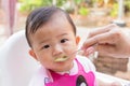 Asian cute baby eating food. Royalty Free Stock Photo