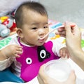 Asian cute baby eating food. Royalty Free Stock Photo