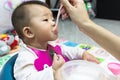 Asian cute baby eating food. Royalty Free Stock Photo