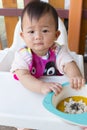 Asian cute baby eating food. Royalty Free Stock Photo