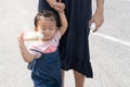 Asian cute baby eating milk in bottle. Royalty Free Stock Photo